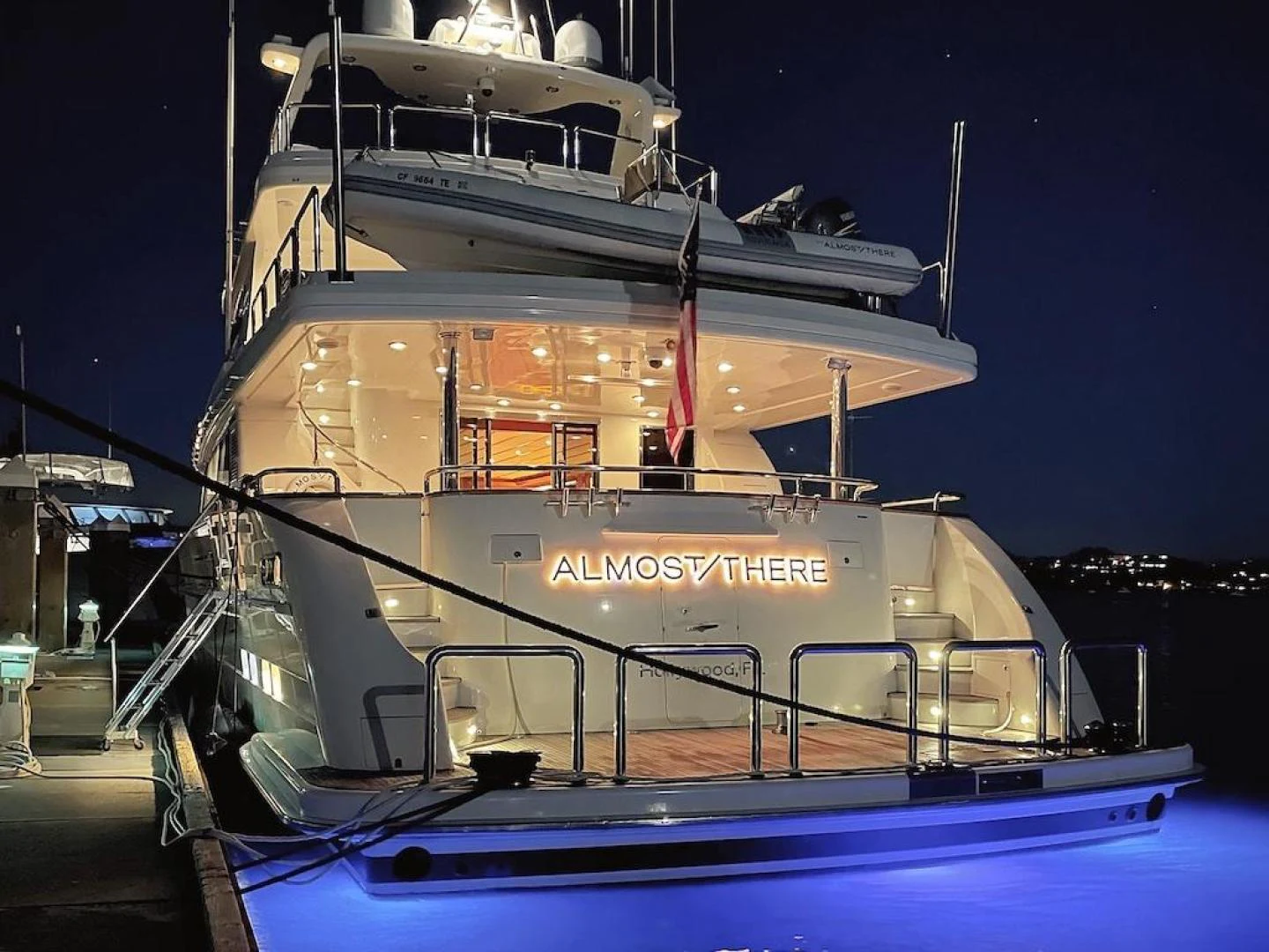 a large boat at night aboard ALMOST THERE Yacht for Sale
