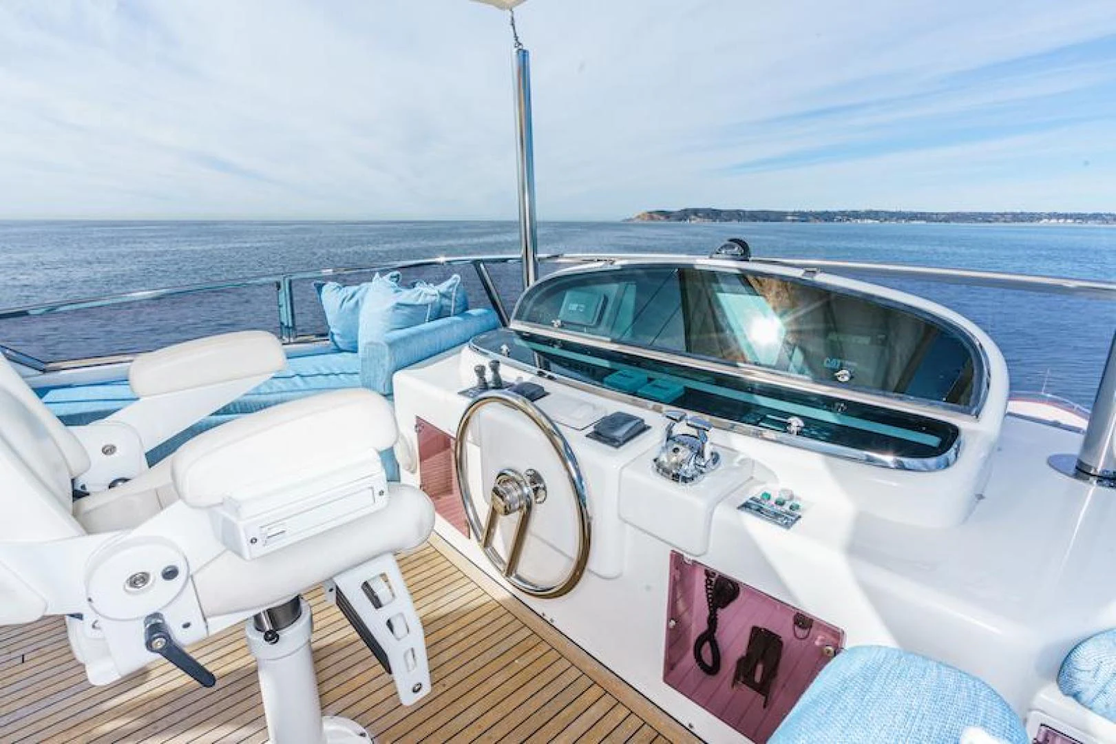 a boat with a steering wheel and a boat on the water aboard ALMOST THERE Yacht for Sale