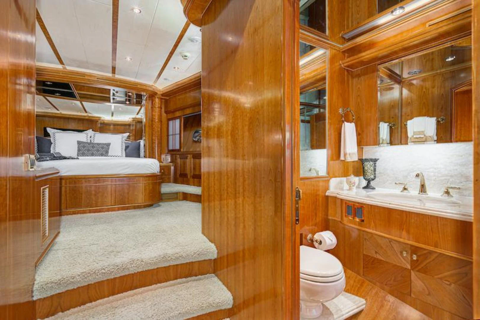 a bathroom with a wood door aboard ALMOST THERE Yacht for Sale