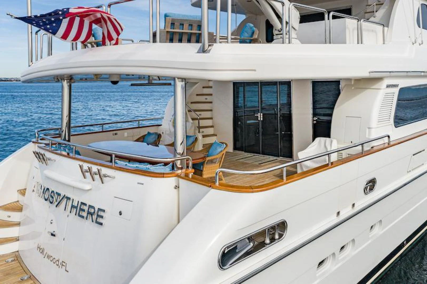 a boat with a flag on the front aboard ALMOST THERE Yacht for Sale