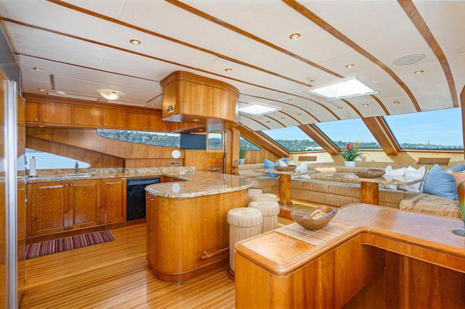 a large kitchen with wooden cabinets aboard ALMOST THERE Yacht for Sale
