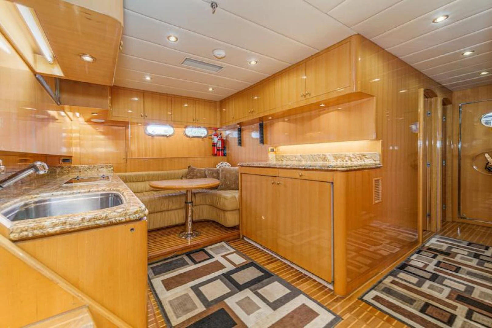 a bathroom with a sink and a rug aboard ALMOST THERE Yacht for Sale