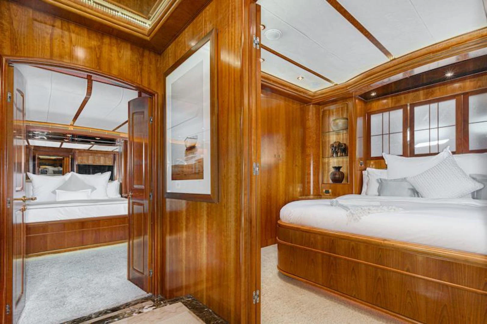 a room with a bed and a mirror aboard ALMOST THERE Yacht for Sale