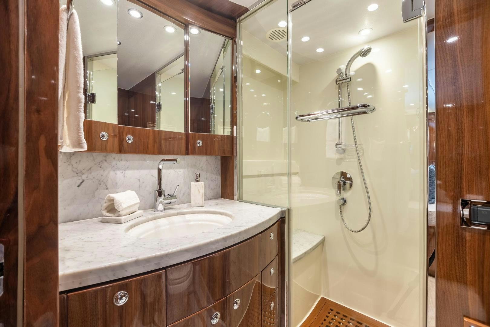 a bathroom with a sink and a shower aboard CUTTING EDGE Yacht for Sale