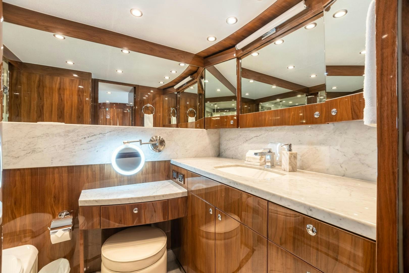 a bathroom with a large mirror aboard CUTTING EDGE Yacht for Sale