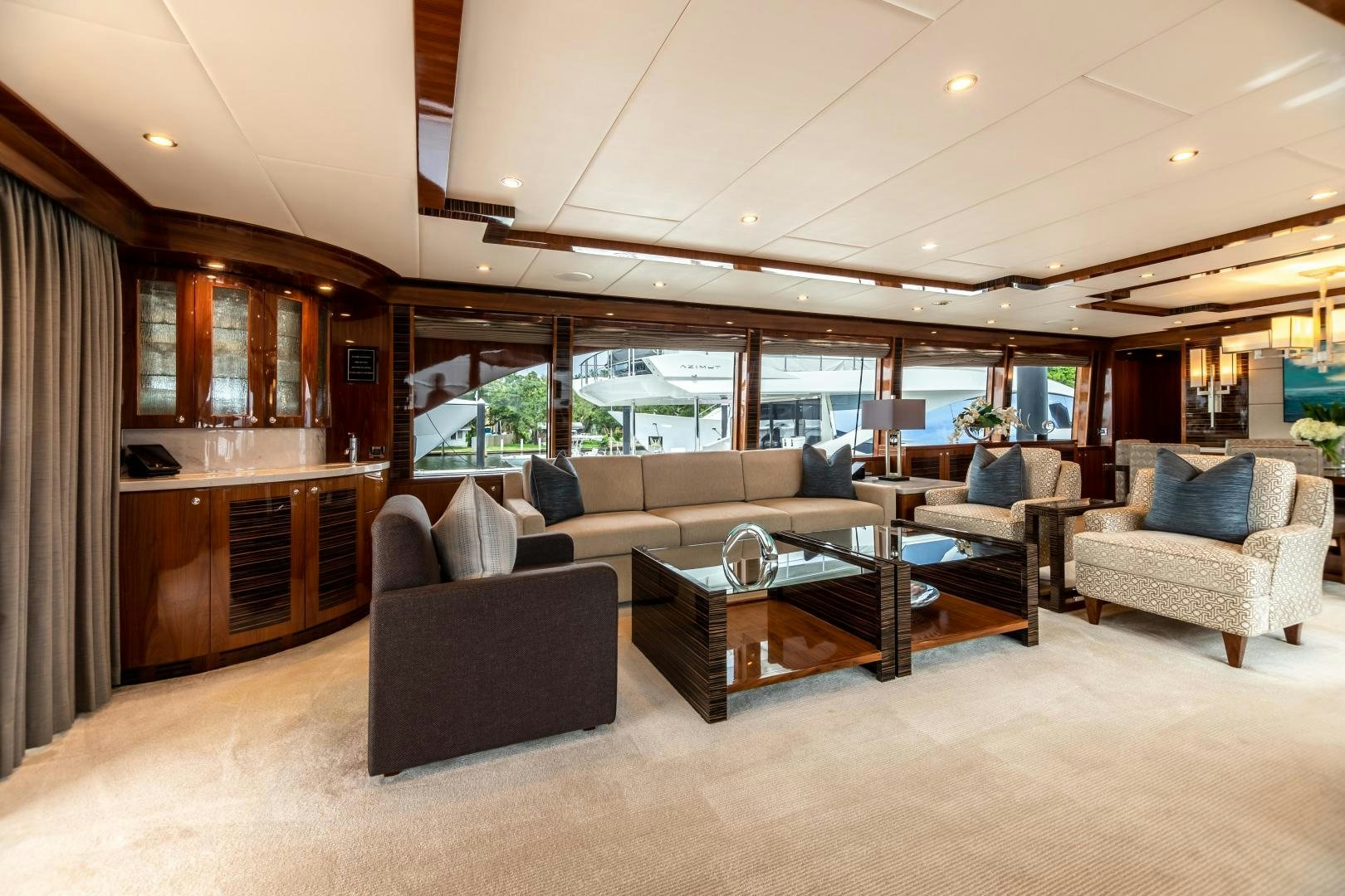 a living room with a large window aboard CUTTING EDGE Yacht for Sale