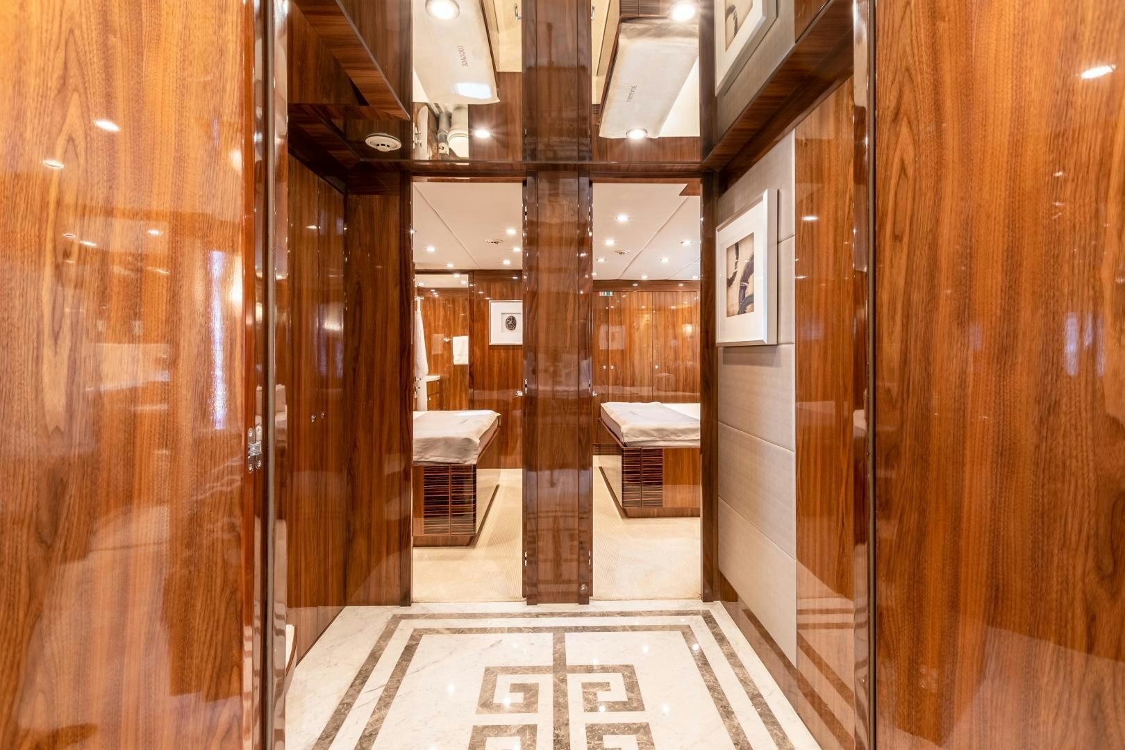 a hallway with wood cabinets aboard CUTTING EDGE Yacht for Sale