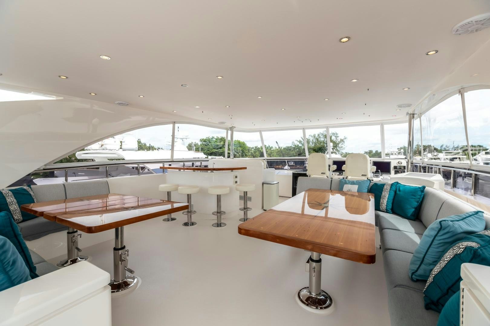 a room with a table and chairs aboard CUTTING EDGE Yacht for Sale