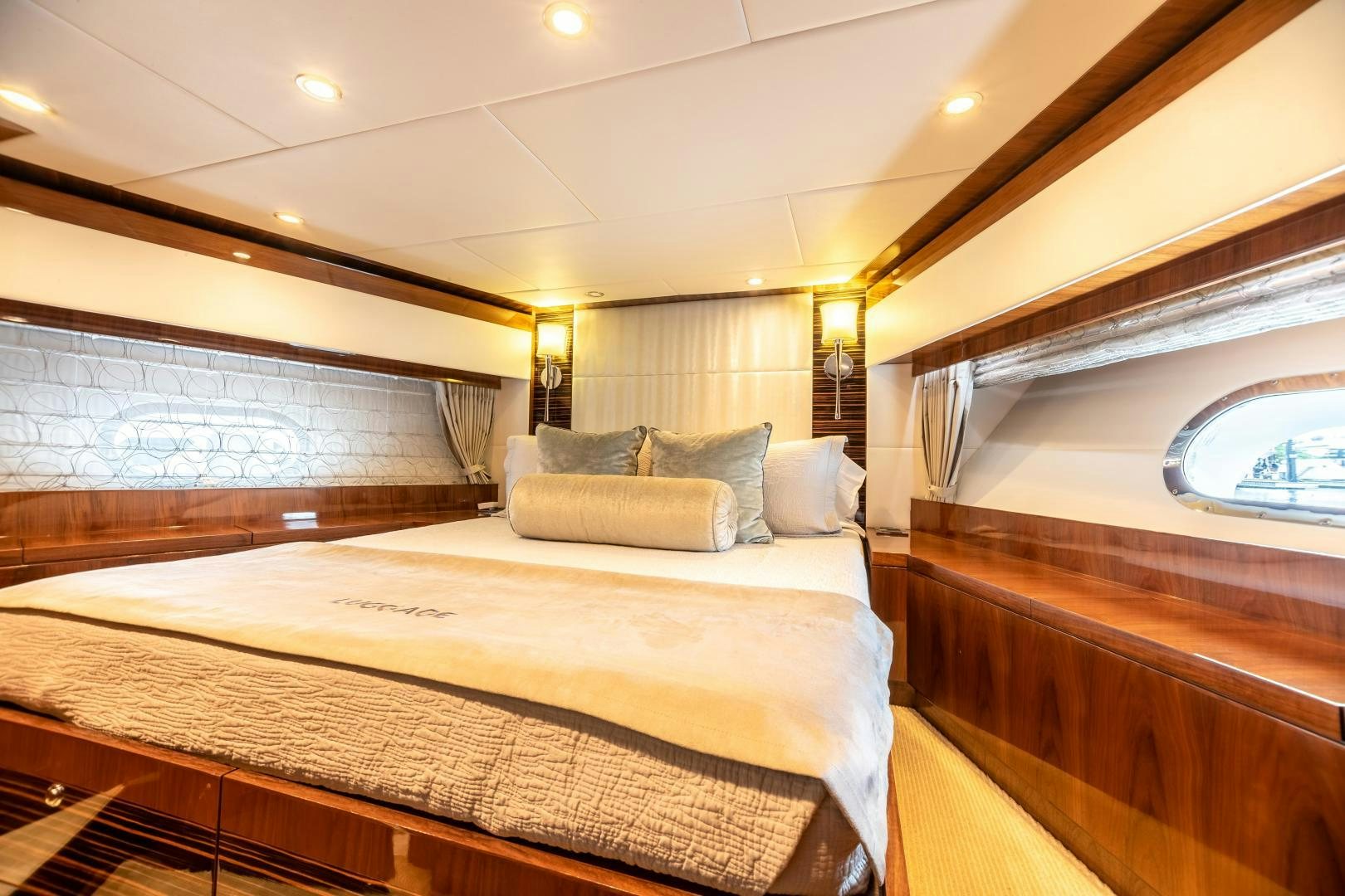 a bed with a couch aboard CUTTING EDGE Yacht for Sale