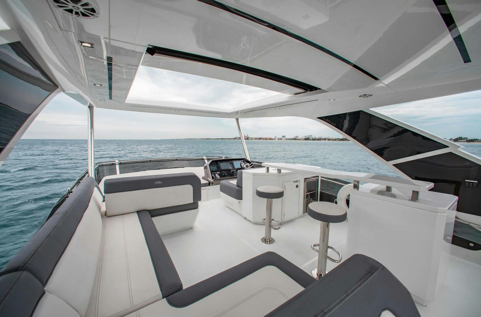 a boat with white furniture aboard LYLA BEE Yacht for Sale