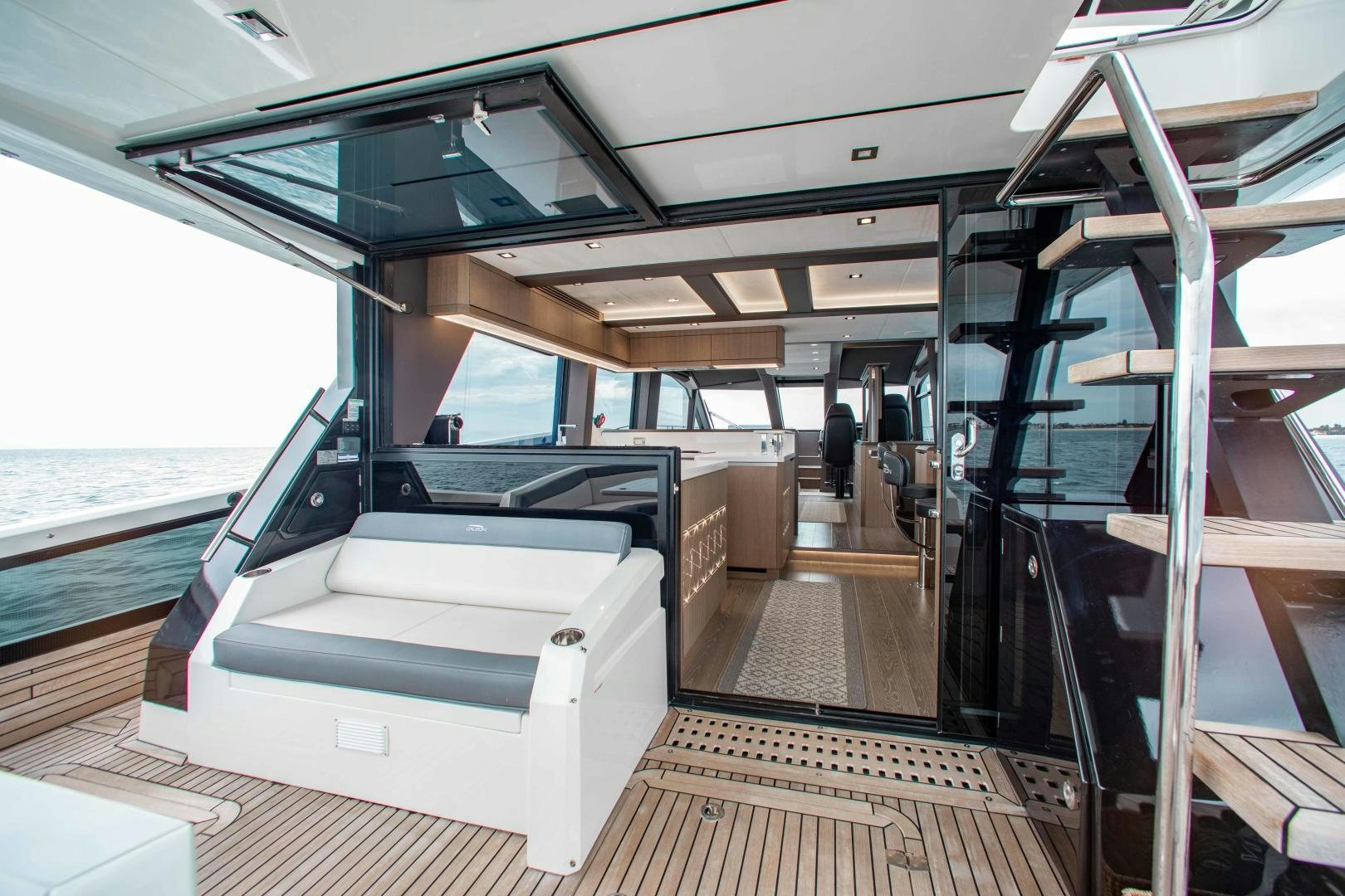 a boat with a bench and a table on the deck aboard LYLA BEE Yacht for Sale