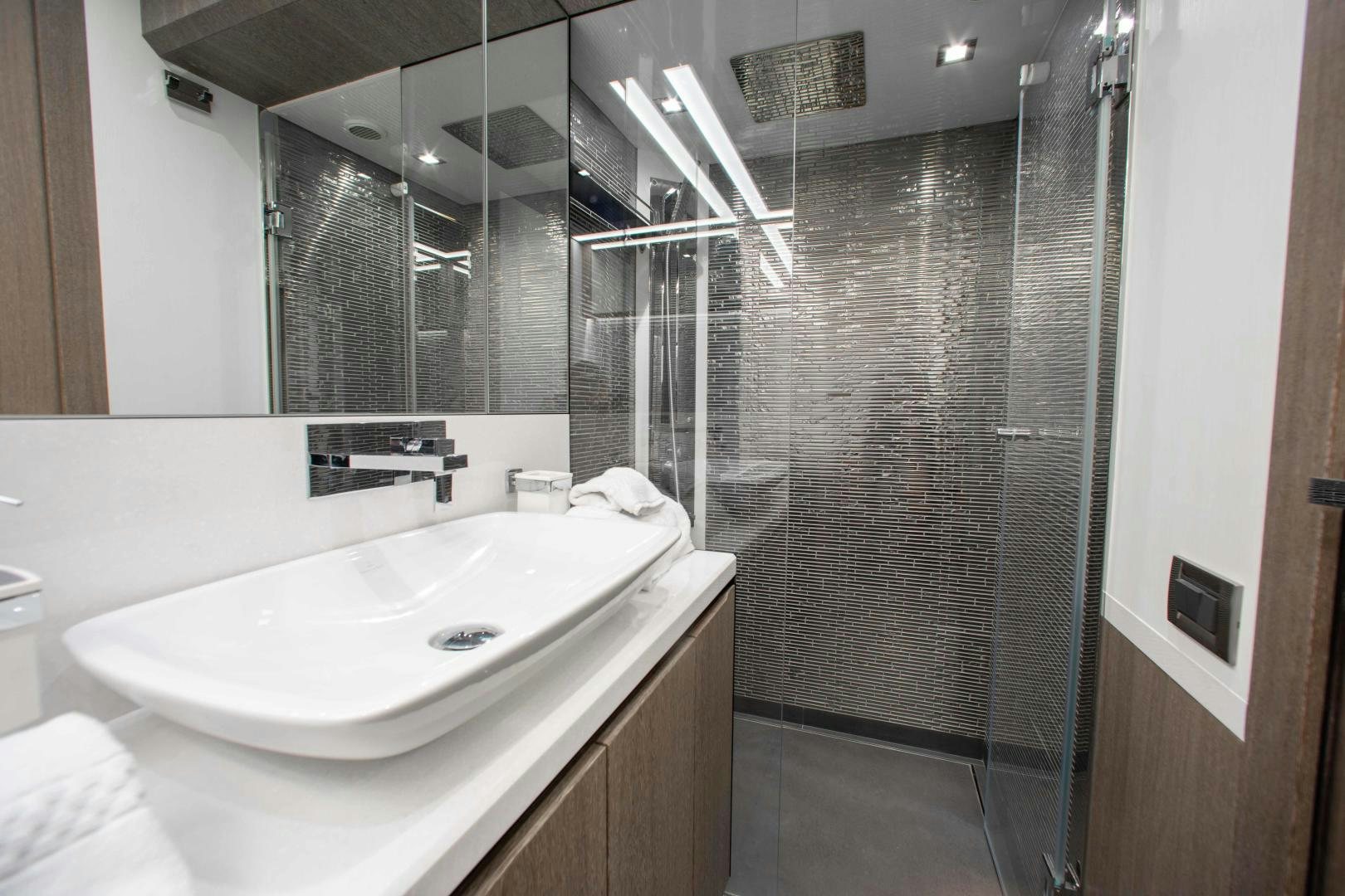 a bathroom with a shower unit and sink aboard LYLA BEE Yacht for Sale