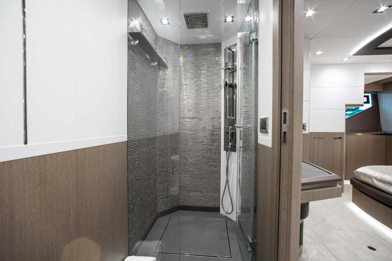 a bathroom with a shower unit aboard LYLA BEE Yacht for Sale