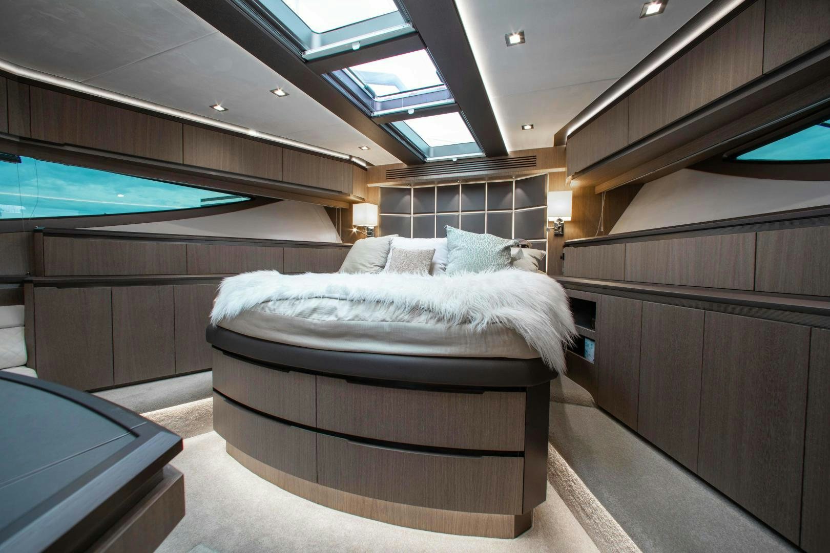 a room with a bed and a desk aboard LYLA BEE Yacht for Sale