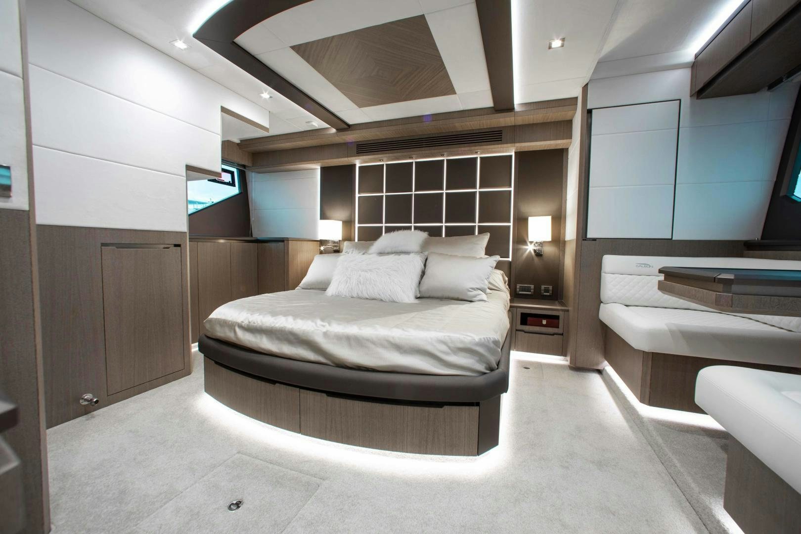 a room with a bed and a desk aboard LYLA BEE Yacht for Sale