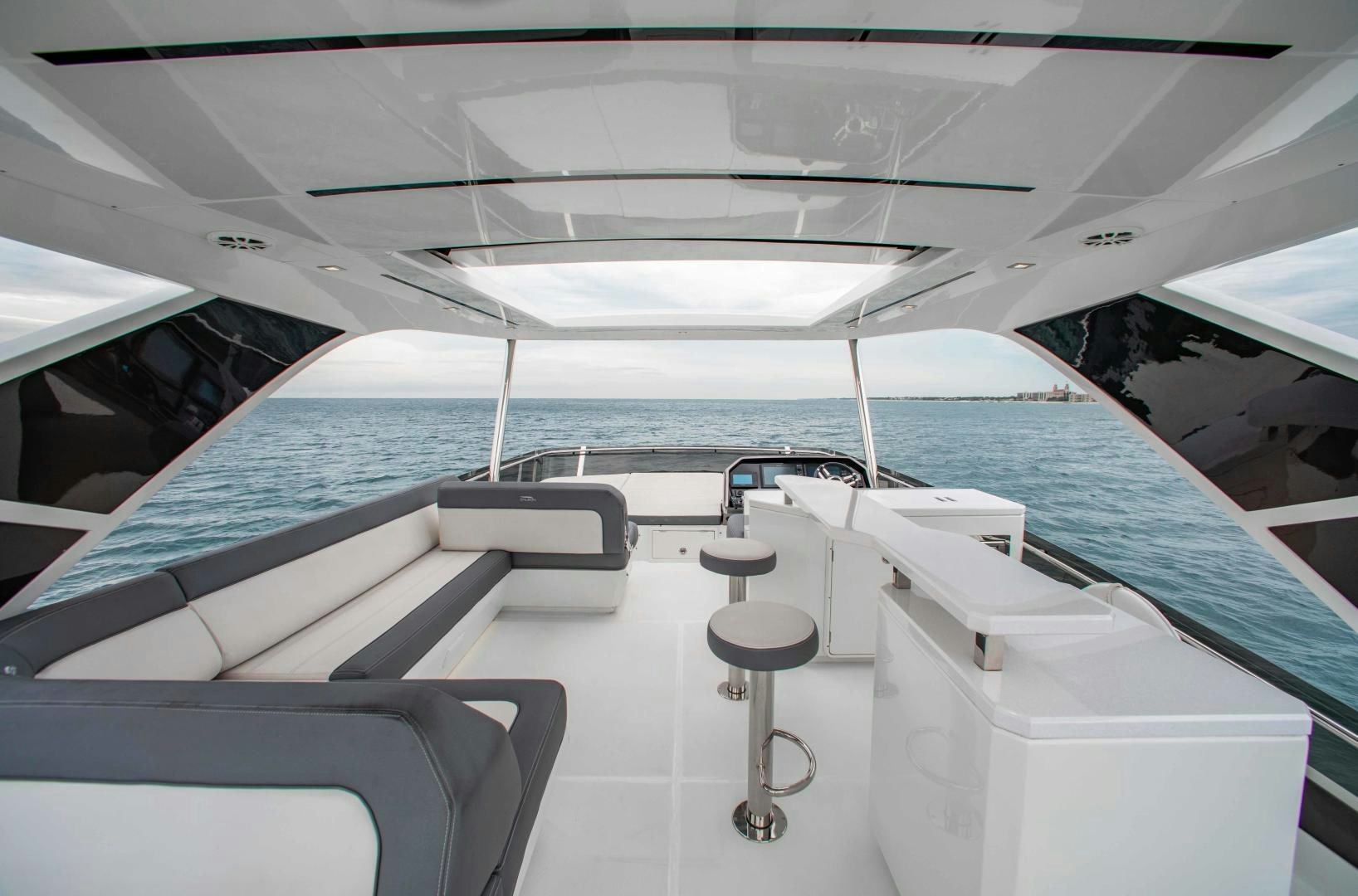 a boat with a stool on the deck aboard LYLA BEE Yacht for Sale