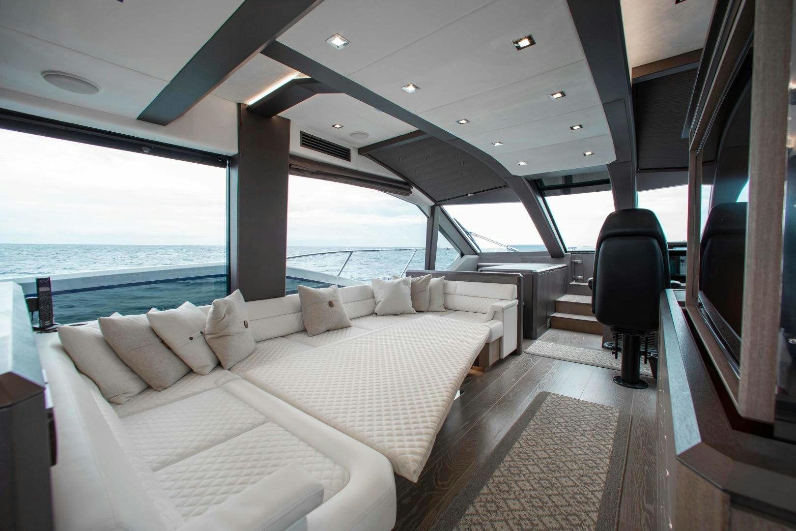 a room with a bed and a chair aboard LYLA BEE Yacht for Sale