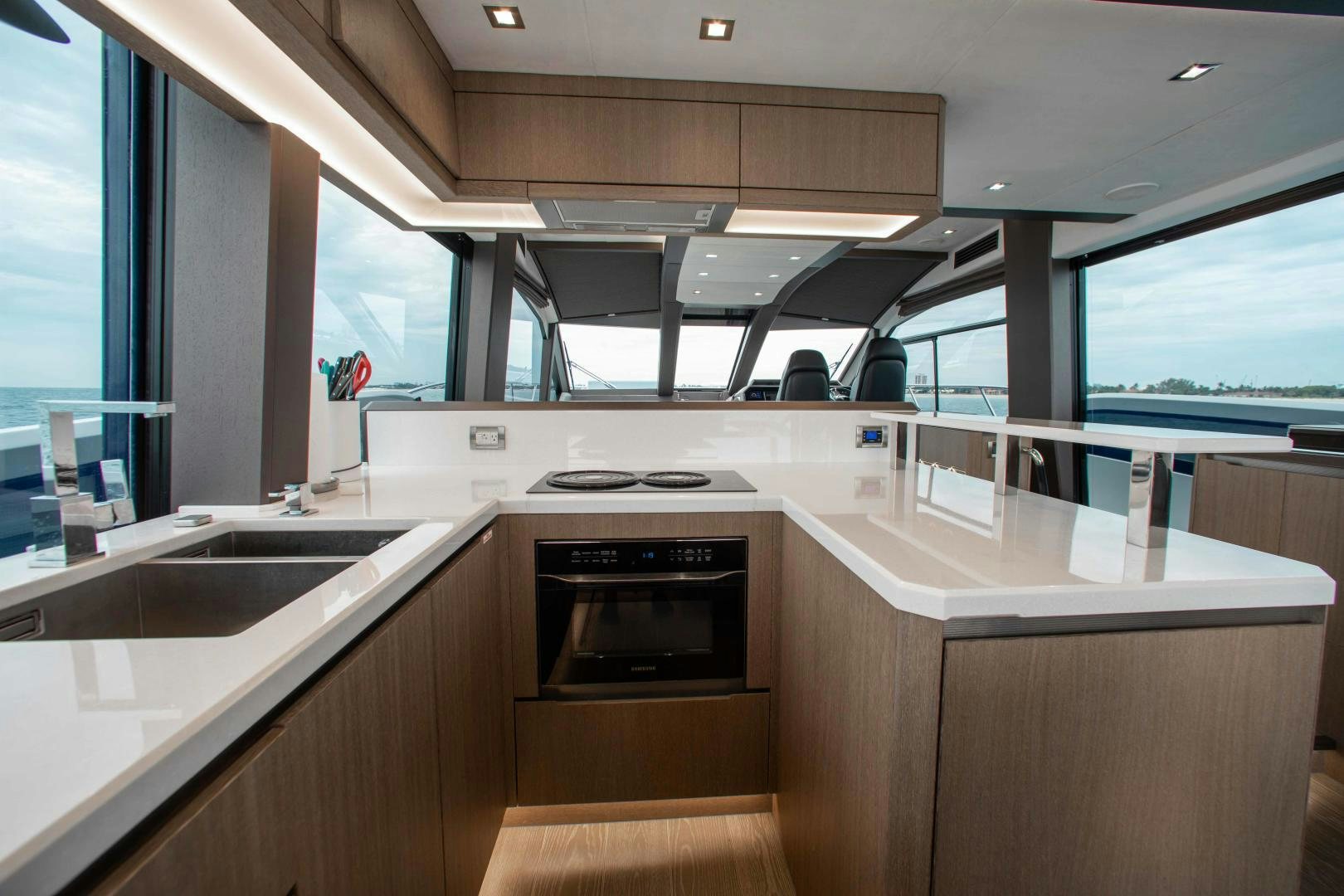 a kitchen with a stove and sink aboard LYLA BEE Yacht for Sale