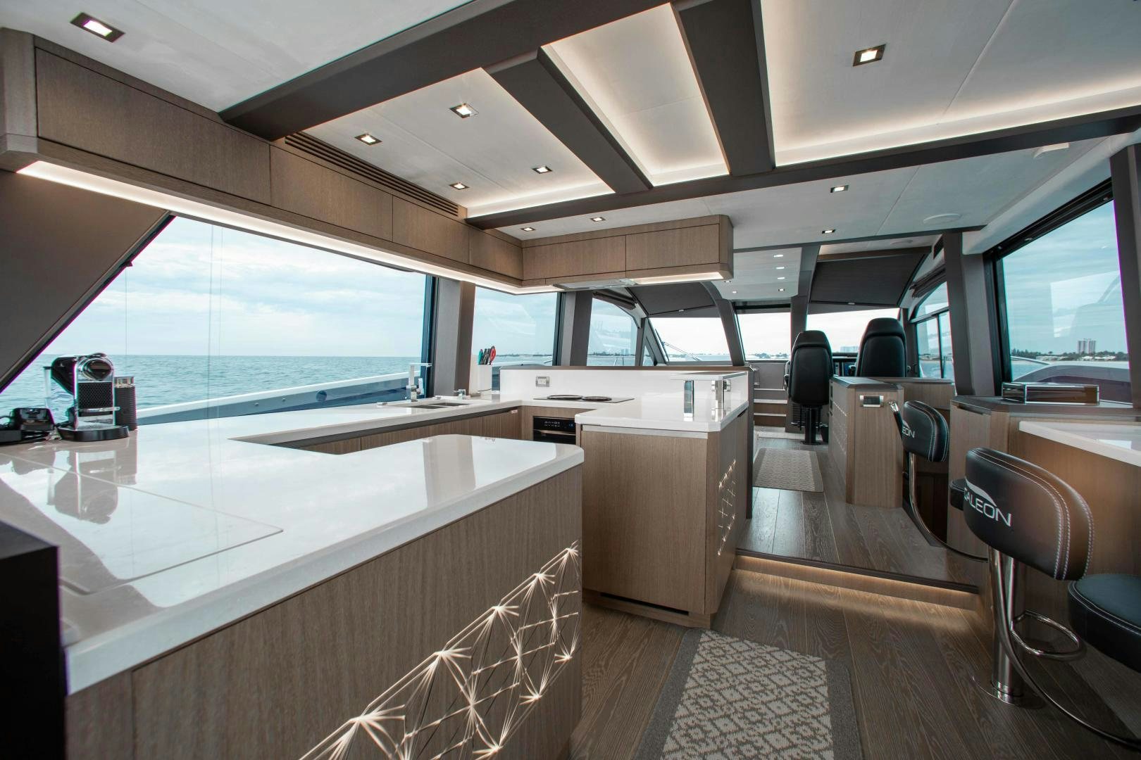inside of a vehicle with a large window and a view of the water aboard LYLA BEE Yacht for Sale