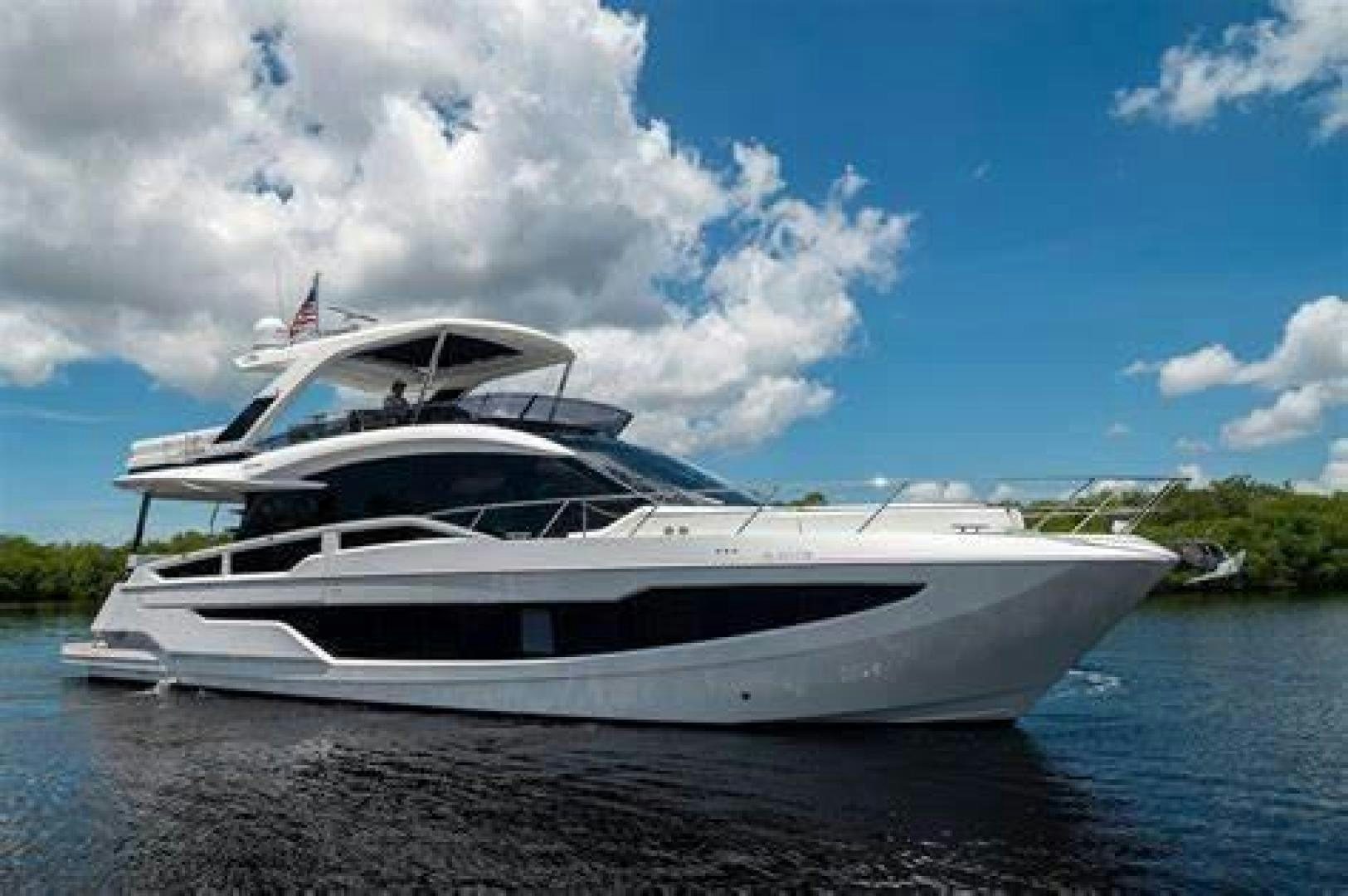 a white yacht on the water aboard LYLA BEE Yacht for Sale