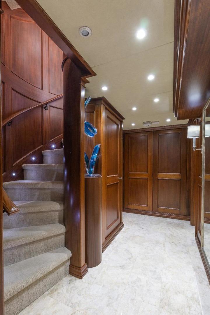 a wood cabinet in a room aboard GITANA Yacht for Charter