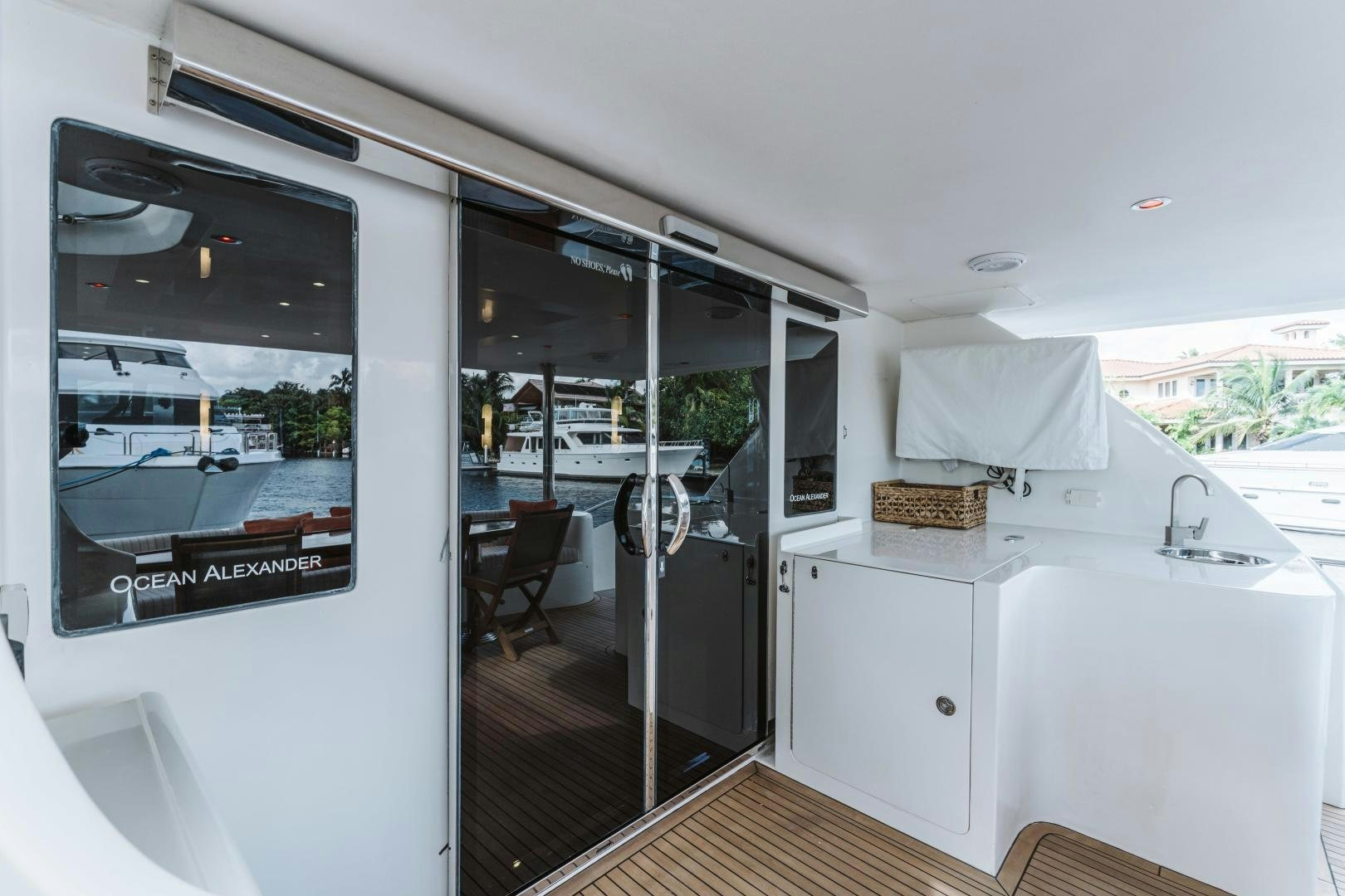 a kitchen with a sliding glass door aboard SKULLDUGGERY Yacht for Sale