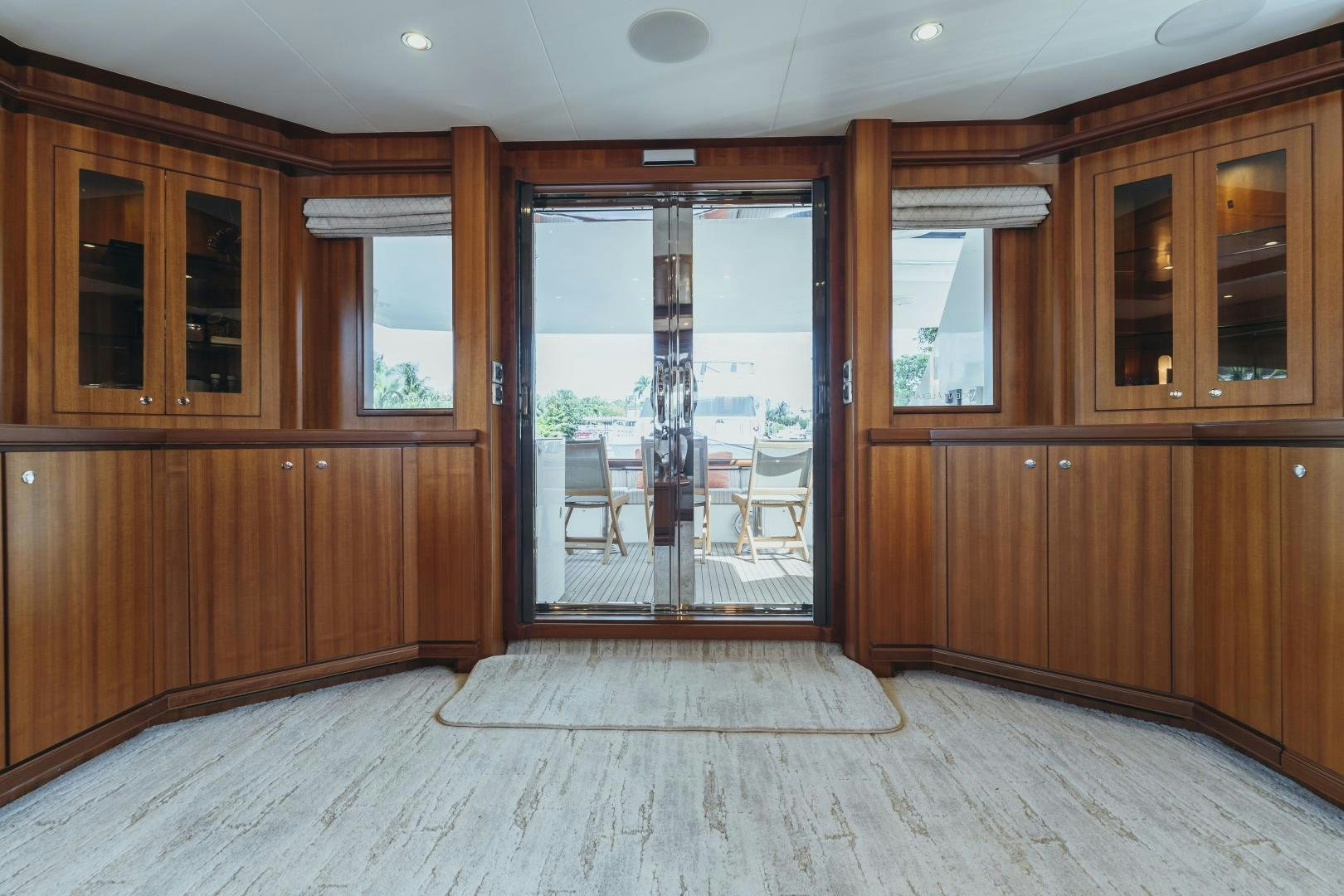 a room with wooden cabinets and a sliding glass door aboard SKULLDUGGERY Yacht for Sale