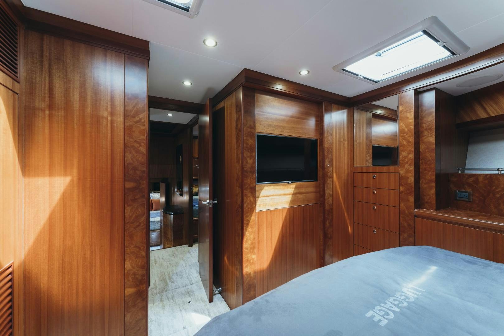 a room with a bed and a closet aboard SKULLDUGGERY Yacht for Sale