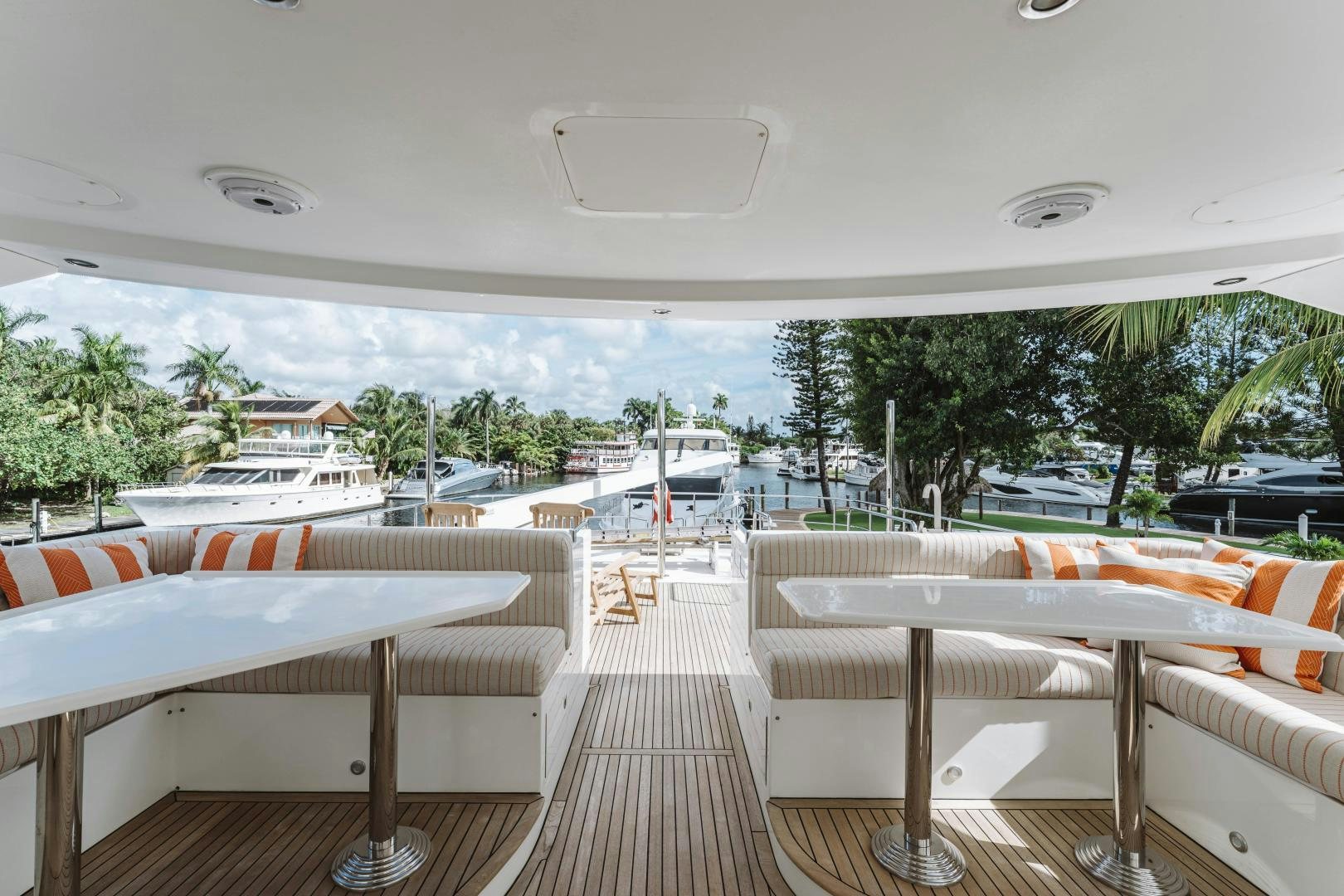 a patio with tables and chairs aboard SKULLDUGGERY Yacht for Sale