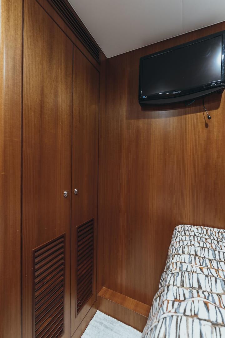 a tv mounted on a wall aboard SKULLDUGGERY Yacht for Sale