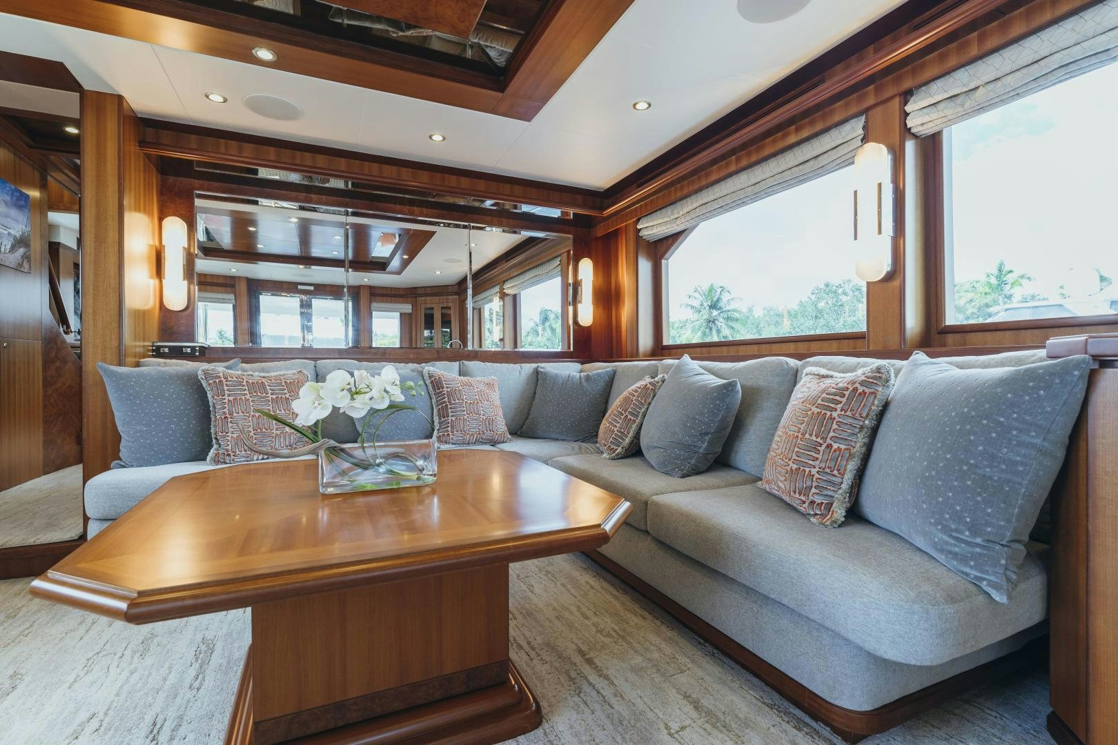 a living room with a couch and a table aboard SKULLDUGGERY Yacht for Sale