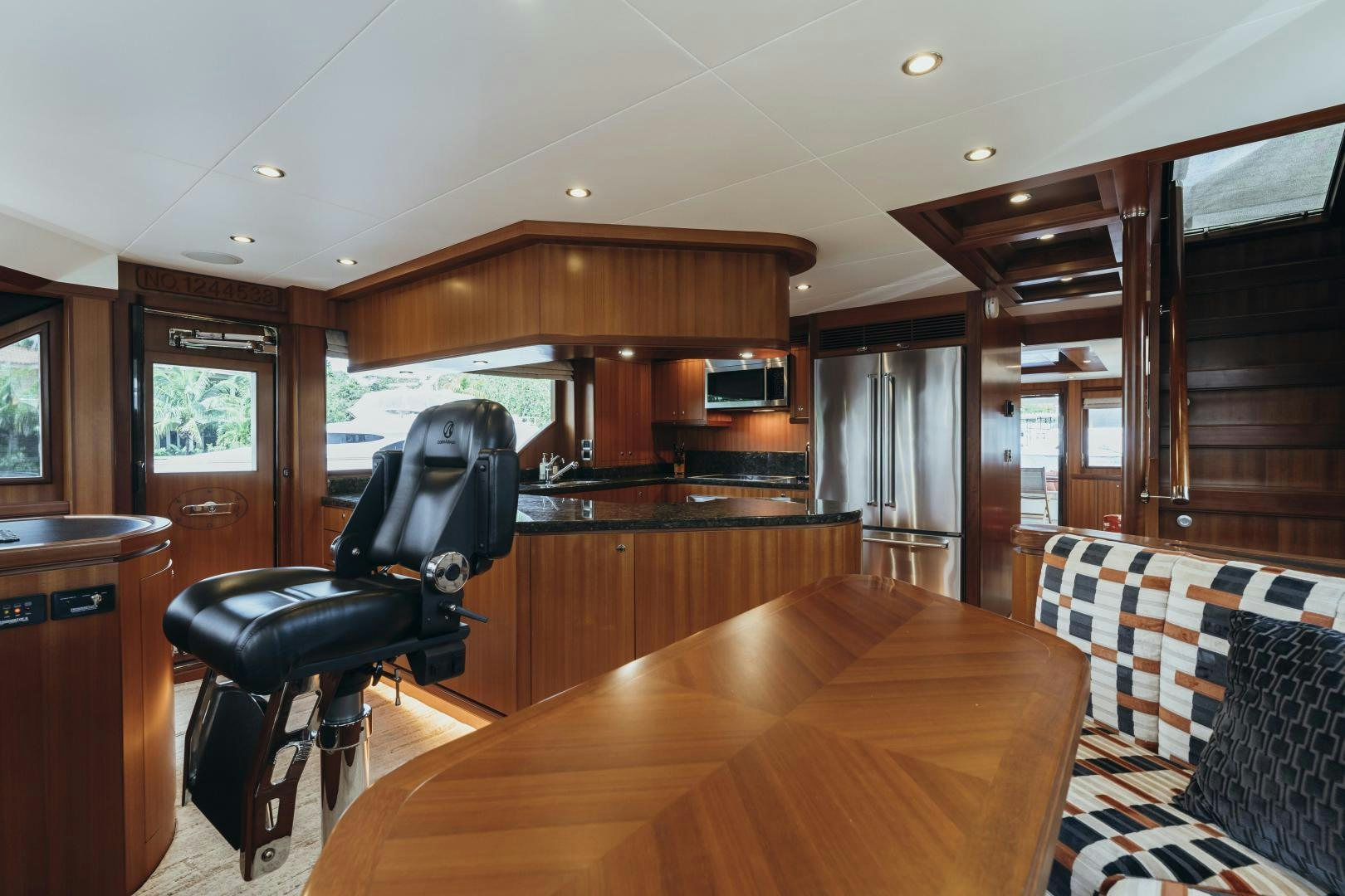 a room with a table and chairs aboard SKULLDUGGERY Yacht for Sale