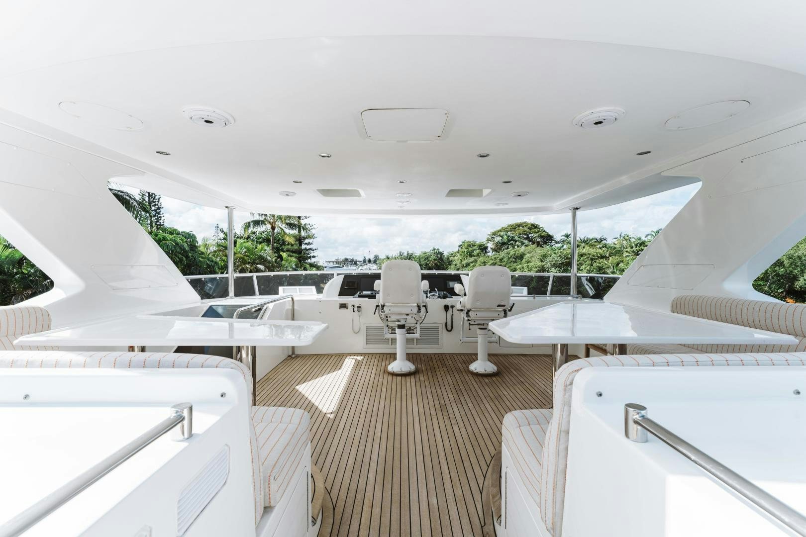 a room with tables and chairs aboard SKULLDUGGERY Yacht for Sale
