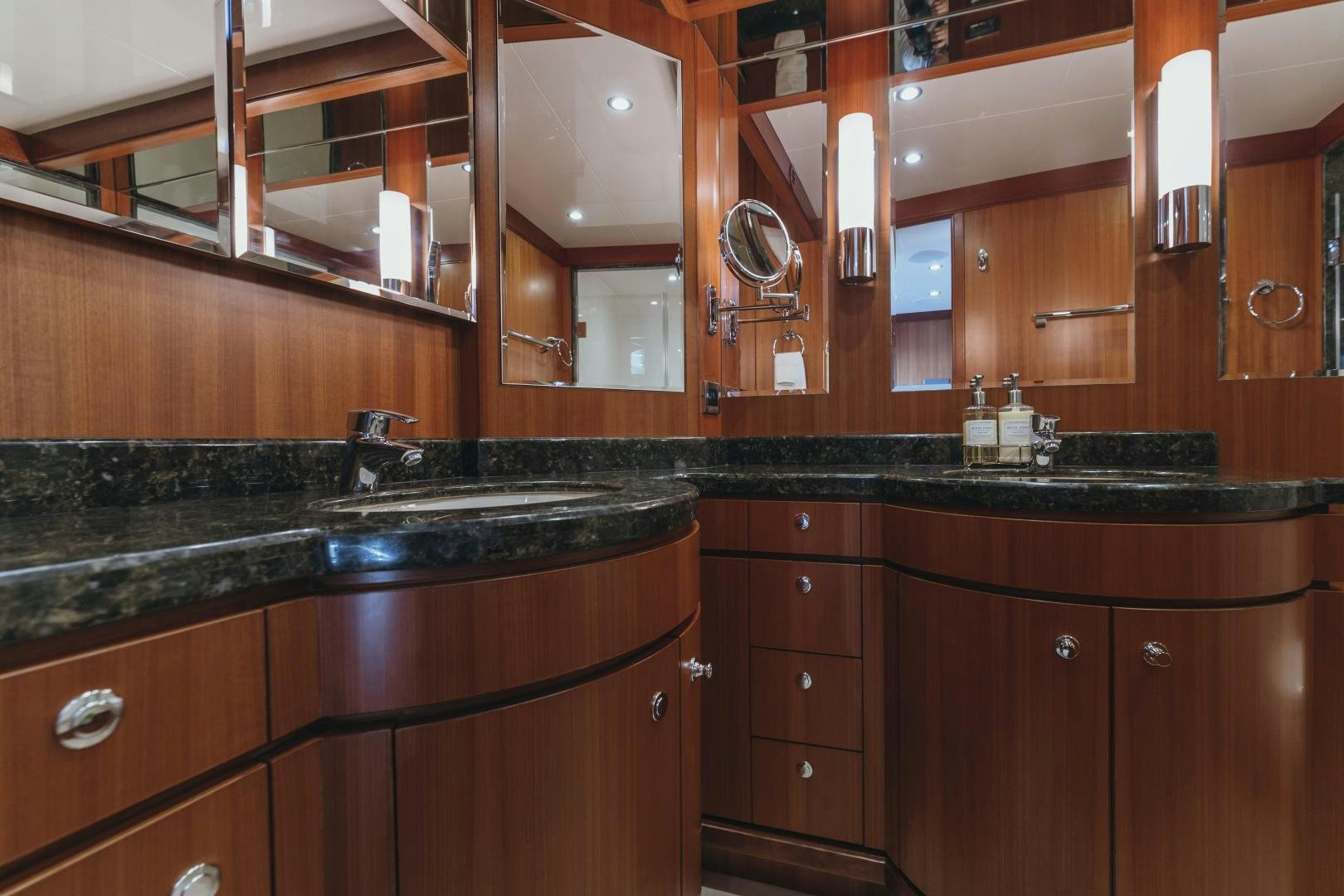 a kitchen with wooden cabinets aboard SKULLDUGGERY Yacht for Sale