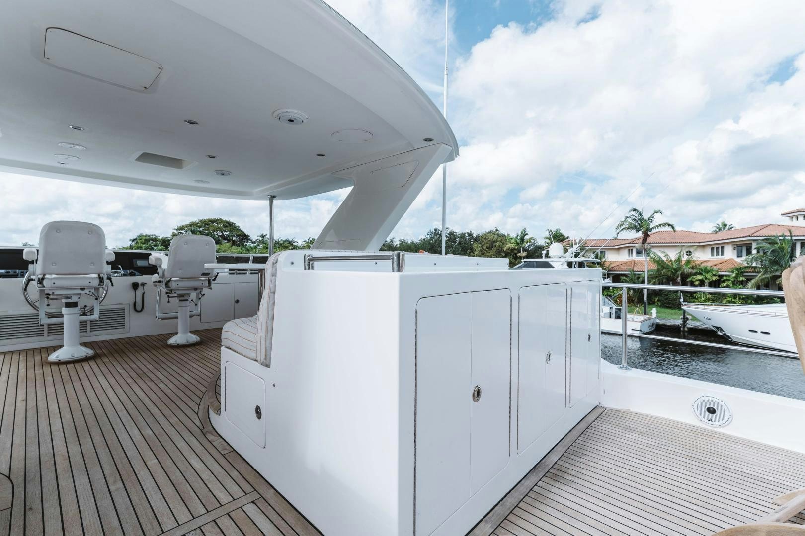 a deck with chairs and a large white container on it aboard SKULLDUGGERY Yacht for Sale