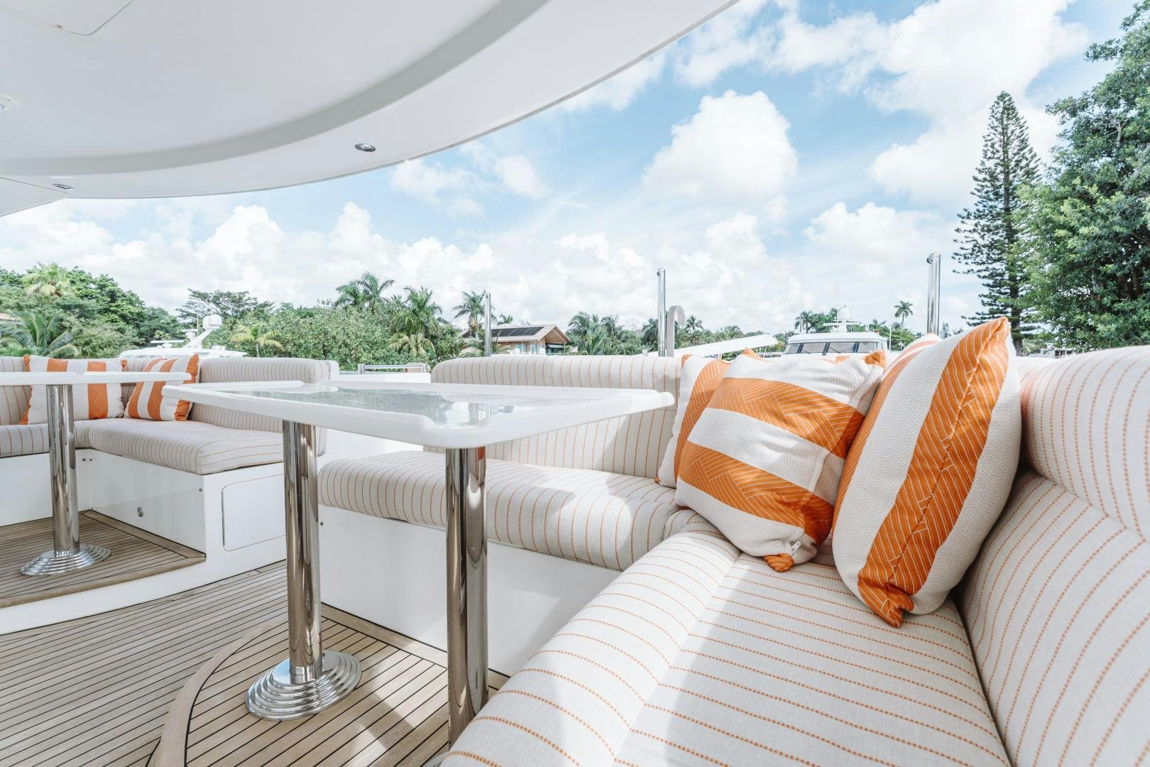 a patio with a table and chairs aboard SKULLDUGGERY Yacht for Sale
