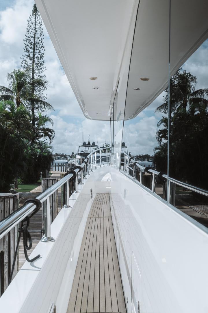 a large white umbrella over a walkway aboard SKULLDUGGERY Yacht for Sale