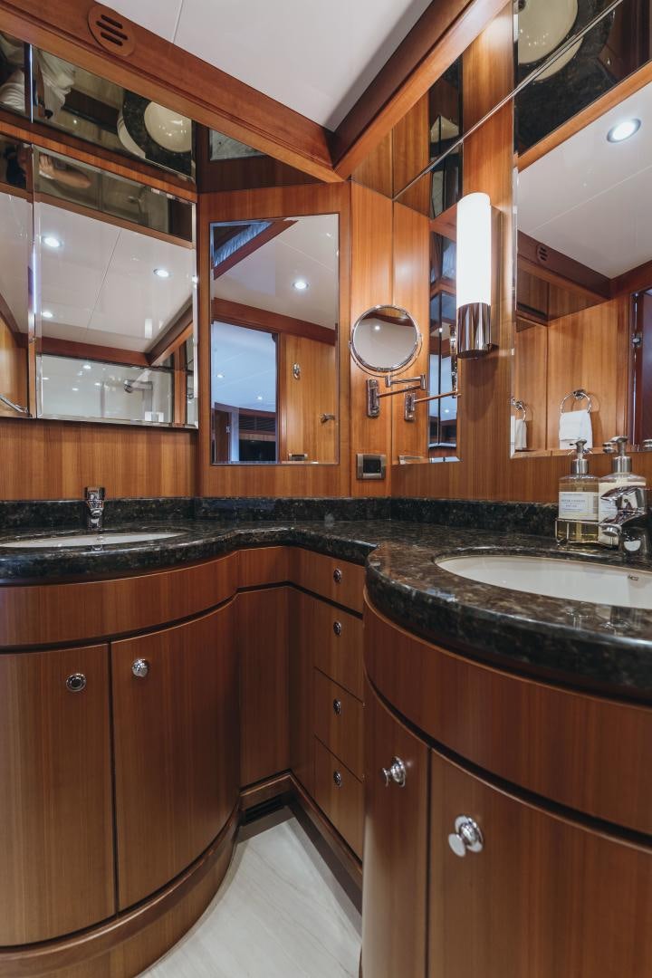 a bathroom with wooden cabinets aboard SKULLDUGGERY Yacht for Sale