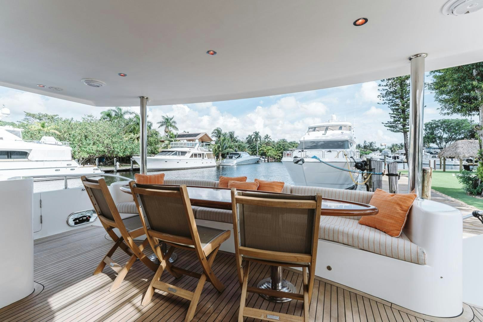 a large patio with a large window overlooking a body of water aboard SKULLDUGGERY Yacht for Sale