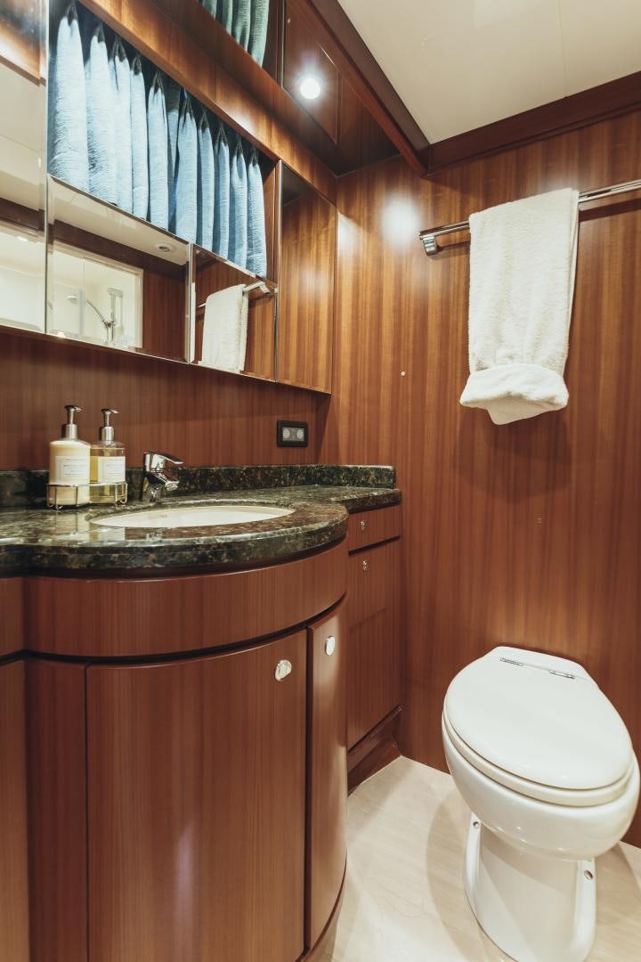 a bathroom with a sink and toilet aboard SKULLDUGGERY Yacht for Sale