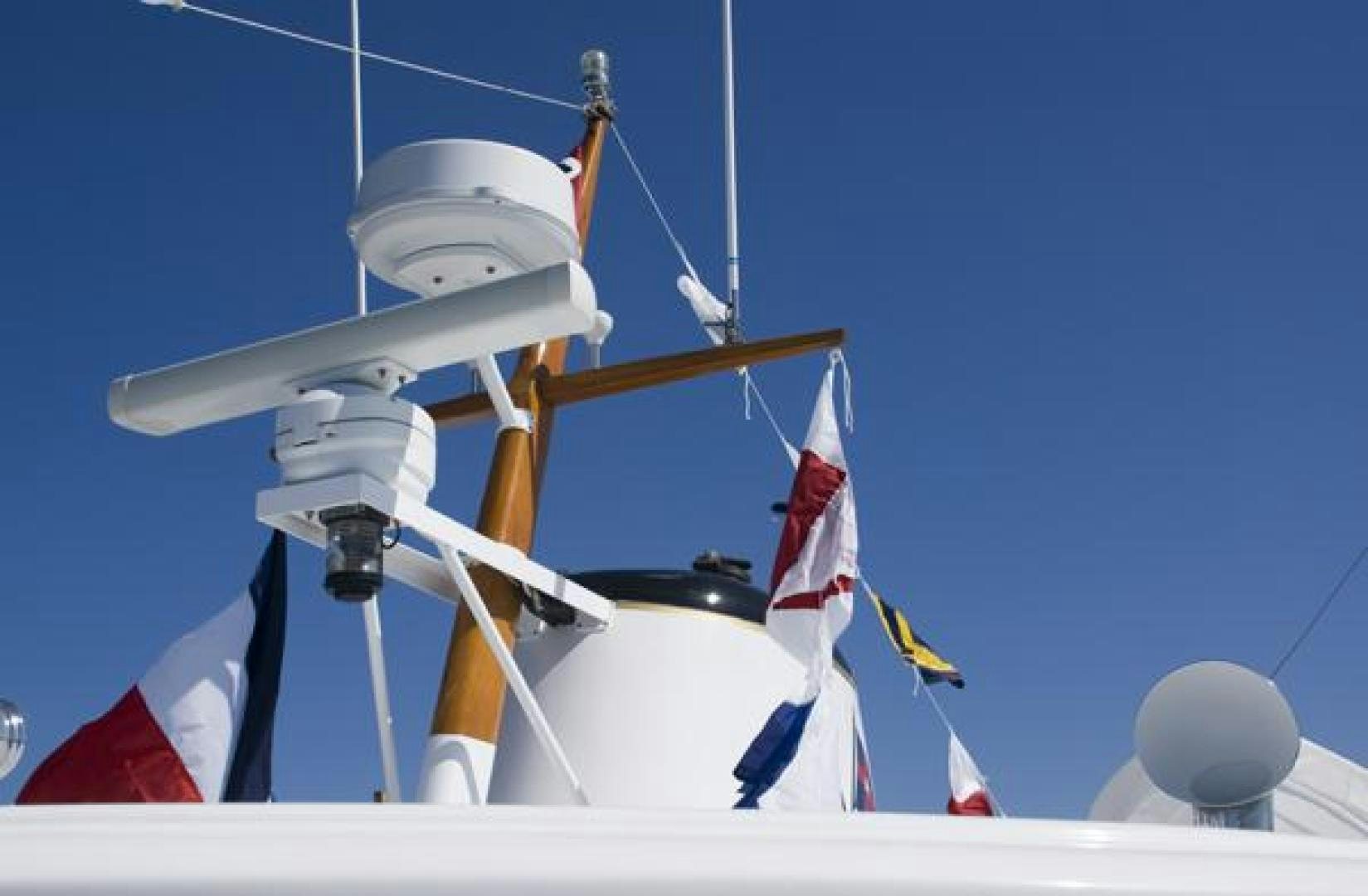 a row of white and red flags aboard AMERICA Yacht for Sale