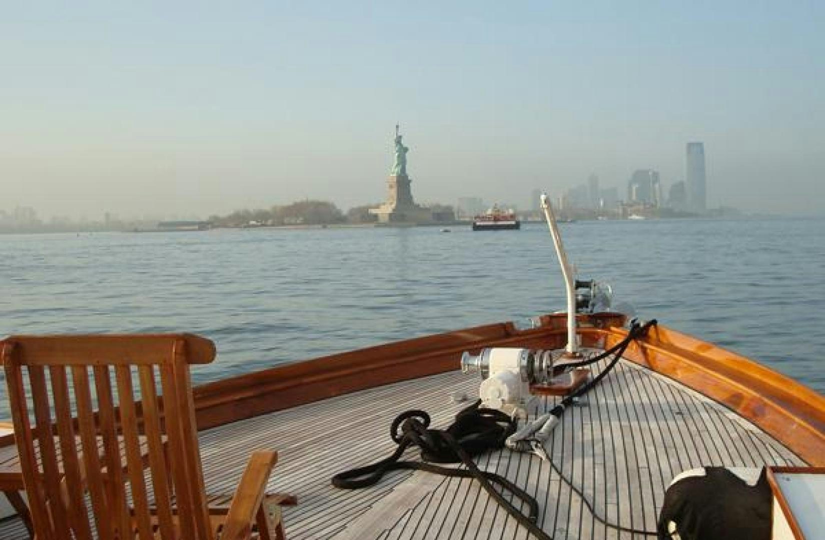 a boat on the water aboard AMERICA Yacht for Sale