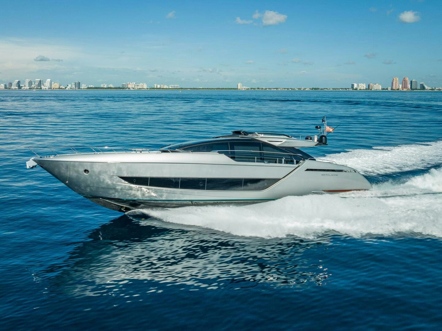 a white yacht in the water aboard LISOLO Yacht for Sale