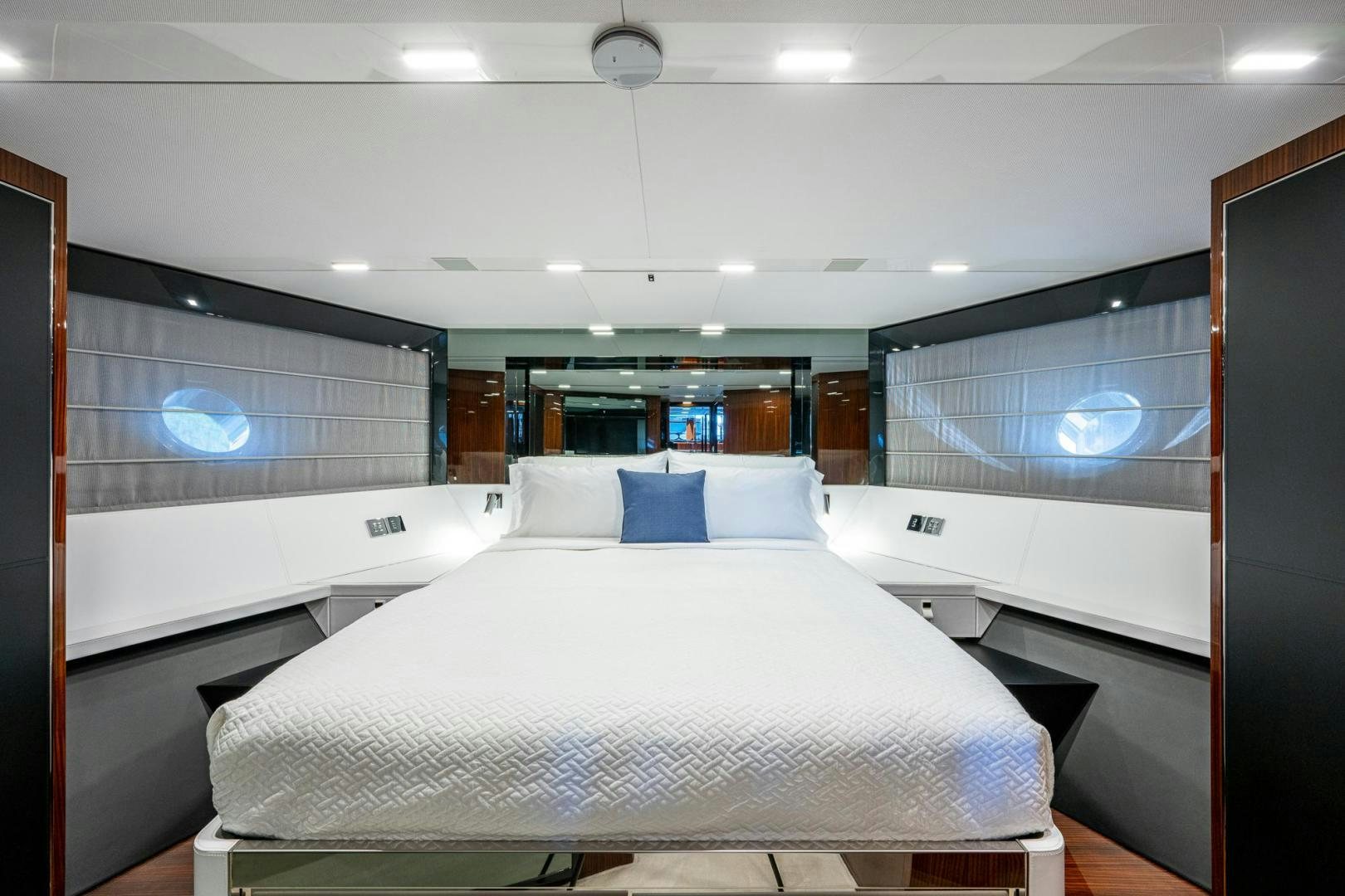 a room with a bed and a window aboard LISOLO Yacht for Sale