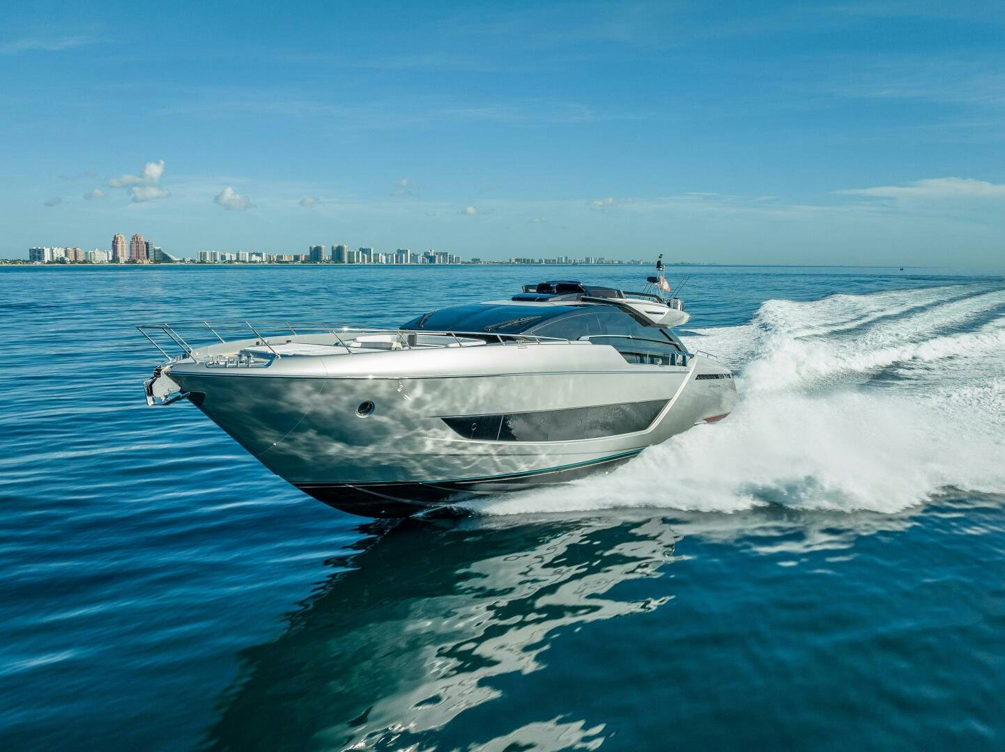 a white boat on water aboard LISOLO Yacht for Sale