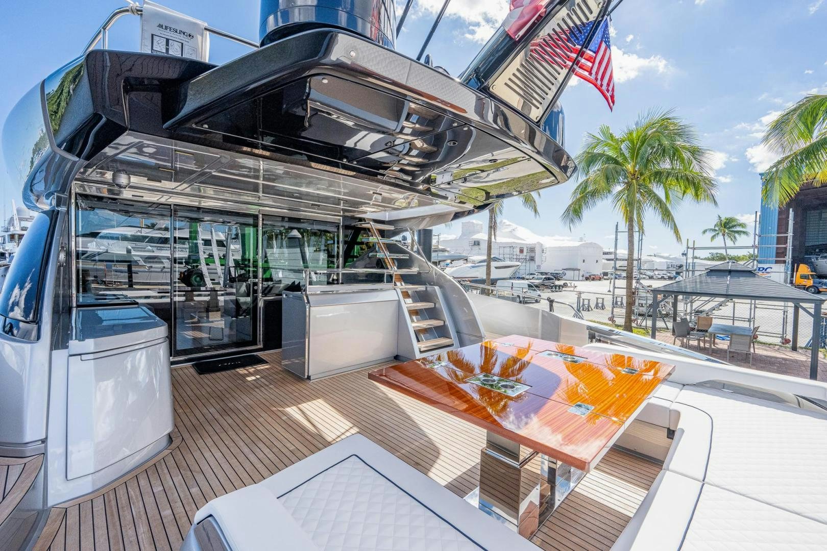 a large white truck with a flag on the roof aboard LISOLO Yacht for Sale