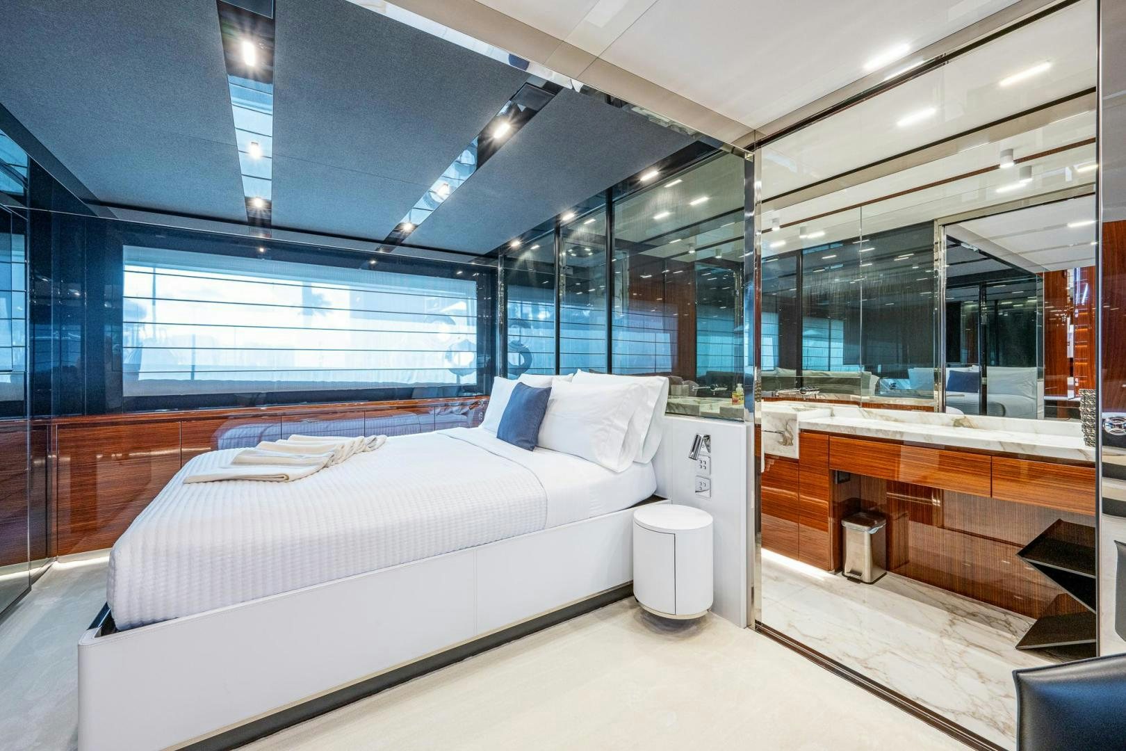 a room with a bed and a desk aboard LISOLO Yacht for Sale