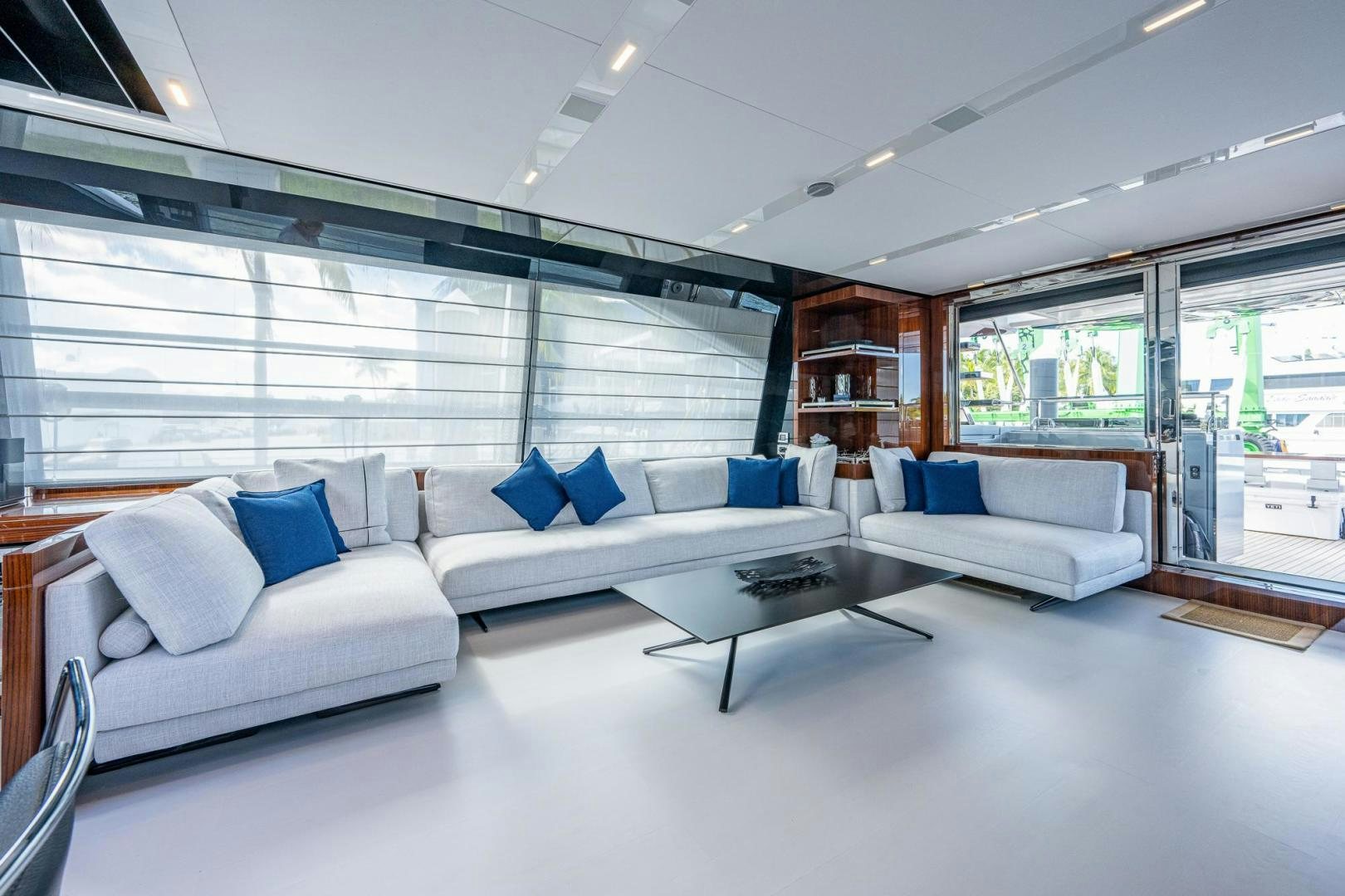 a room with white couches and a table aboard LISOLO Yacht for Sale
