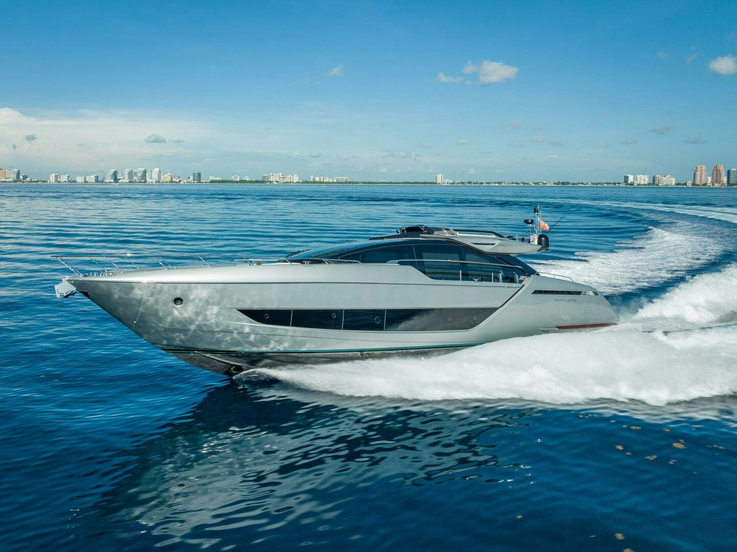 a white yacht on the water aboard LISOLO Yacht for Sale