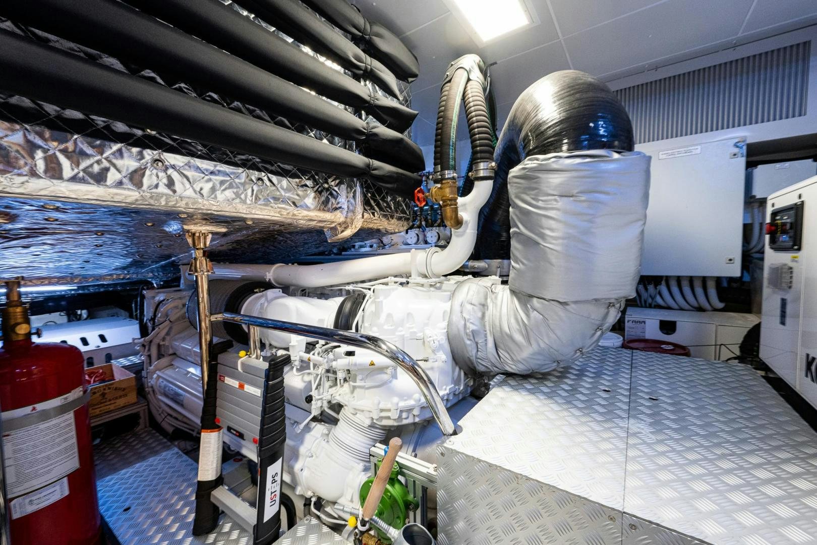 a person in a white suit in a factory aboard LISOLO Yacht for Sale